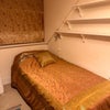 Photo 6: Single bed in tenant room. Window looks out onto the garden and canal.