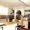 Photo 6: Fully-equipped kitchen.
