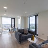 Photo 2: Kitchen with a fridge over microwave sofas dining table shared by 4 people