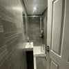 Photo 5: One of three modern shower rods pms.  