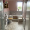 Photo 6: Upstairs bathroom down stairs bathroom has shower over bath 