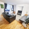 Photo 1: Large Reception room opening to Conservatory Dining room
