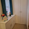 Photo 3: Double rail fitted wardrobe and cupboard for t-shirts etc. More storage is to the left