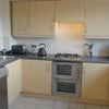 Photo 5: Double oven, gas hob and dishwasher