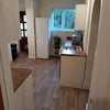 Photo 6: kitchen view 3 withg NEW FLOORING wider view from Hallway door to back door