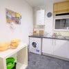 Photo 6: Kitchen has washing machine, fridge freezer, microwave.