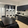 Photo 8: laundry area with Bosch washing machines and tumble dryers