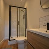 Photo 9: Communal Bathroom 
