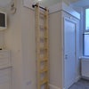 Photo 4: Above ensuite storage area