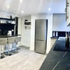 Photo 7: Fully equipped kitchen with 4 double cabinets, plugs and open shelving.