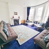Photo 1: Drawing room with oblique sea views, seats 9-12
