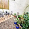 Photo 15: Garden with 2 tables and 7 chairs