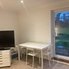 Photo 7: Shared communal living room with dining area and balcony 