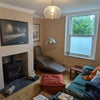 Photo 3: Front room with woodburner