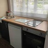 Photo 4: Kitchen has oven, hob, fridge freezer, microwave, washing machine. 