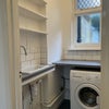 Photo 7: Laundry cupboard  