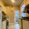 Photo 3: Kitchen leading to outdoor space
