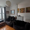 Photo 7: tv area (folding tables under sofa's for tv dinners)