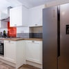 Photo 4: Kitchen showing fridge freezer