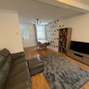 Photo 2: Living area with 2 sofas and dining table