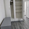 Photo 2: Built in wardrobe on left and shelves on right
