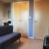 Photo 3: Room 1 (double en suite) - TV/seating area, study desk shown in background