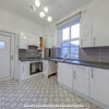 Photo 2: Kitchen with washer/dryer, fridge, freezer 