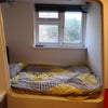 Photo 13: Bedroom 3 with projector, double bed, double wardrobe, desk, chest of drawers