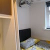 Photo 14: Bedroom 3 with projector, double bed, double wardrobe, desk, chest of drawers