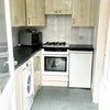 Photo 8: Kitchen - door opens to external rear area 