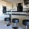 Photo 6: Fully equipped modern kitchen with seating area