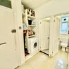 Photo 7: Bathroom with bath shower & sink inside left door & right door is a loo. Washer dryer.