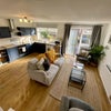 Photo 6: A cosy lounge area has lots of seating and TV