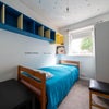 Photo 9: Best suits a single person. Wooden bed, shelves, wardrobe, chair and desk. very bright