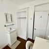 Photo 2: Bedroom 4 - own sink, wardrobe, desk, chair and lamp