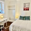 Photo 2: Bedroom 1 large window, double bed, newly painted room, large wardrobe, white bedside draws, bedside