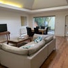 Photo 6: Living room with large skylights and facing onto private patio garden 