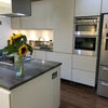 Photo 5: Spacious kitchen with gas hob and eye level oven and large Fridge freezer with main living area