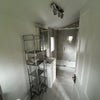 Photo 9: En-suite, shower and sink view. Light up vanity mirror