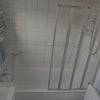 Photo 5: Bathtub and shower