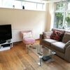 Photo 4: Relax and unwind in this cozy, beautifully furnished living room — perfect for quiet evenings or e