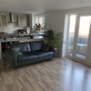 Photo 4: Living room with kitchen and balcony 
