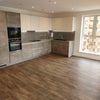 Photo 4:  Kitchen & living room (before furnishing)