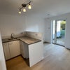 Photo 8: Kitchenette to bed area and back garden 
