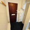 Photo 6: Entry with storage shoe cabinets and wall-mounted hangers