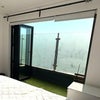 Photo 2: Bifold doors opening up to terrace with fake grass which gets lots of sun!