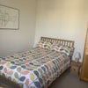 Photo 2: Small double bed, wardrobe