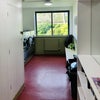 Photo 8: Ground floor laundry room with library corner