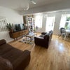 Photo 1: Large share living room overlooking the garden. Sun facing. 