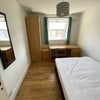 Photo 4: The vacant room is on the top floor and has sun facing window which overlooks the garden.